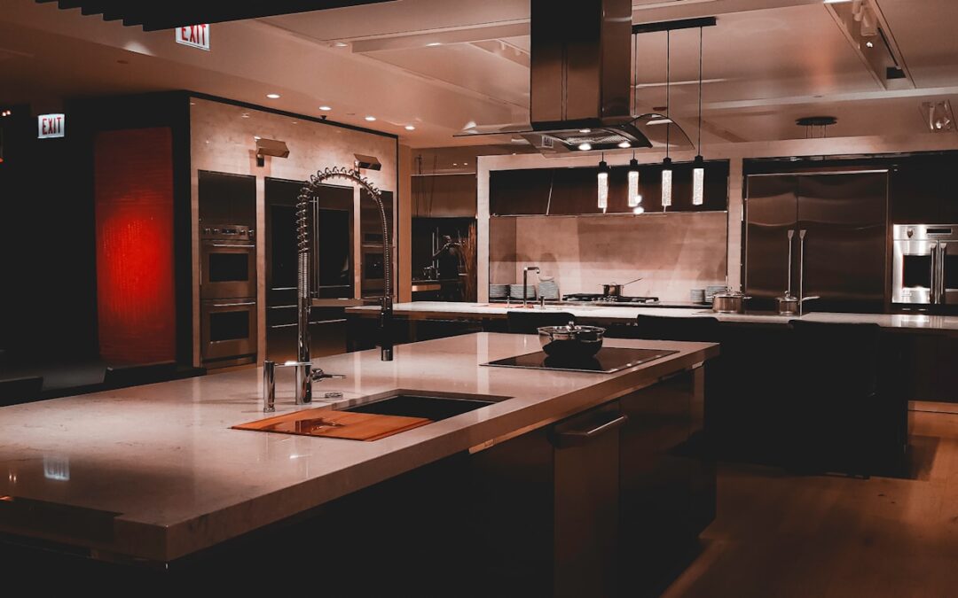 A large kitchen with a center island and stainless steel appliances