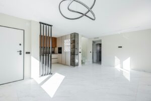 Modern living room with open kitchen and minimalist decor